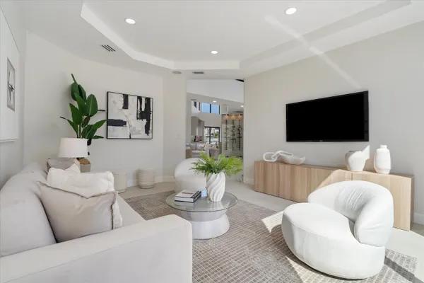 a bathroom with a double vanity sink a mirror and a bathtub