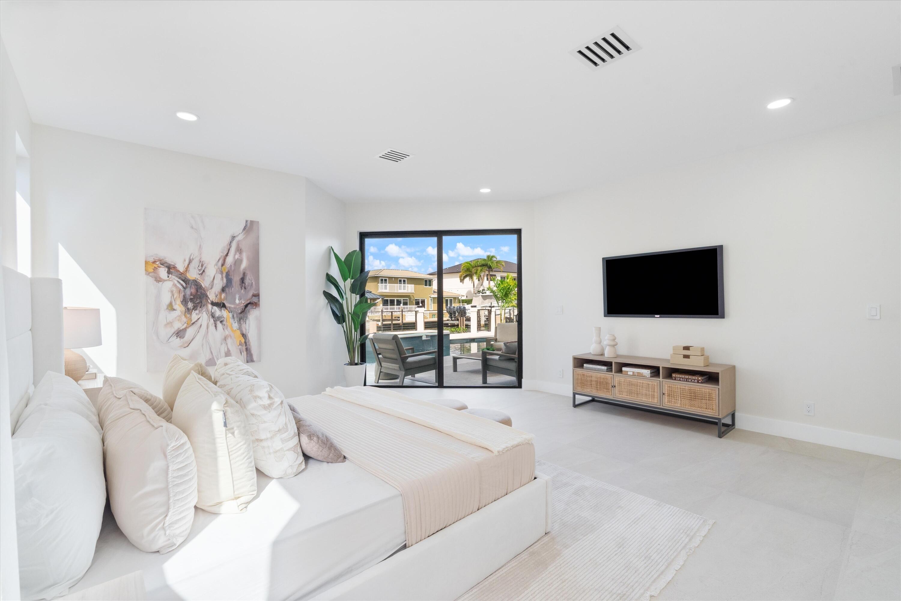 3721 Northeast 30th Avenue Lighthouse Point, FL 33064 - Photo 26 of 70 a living room with furniture and a flat screen tv