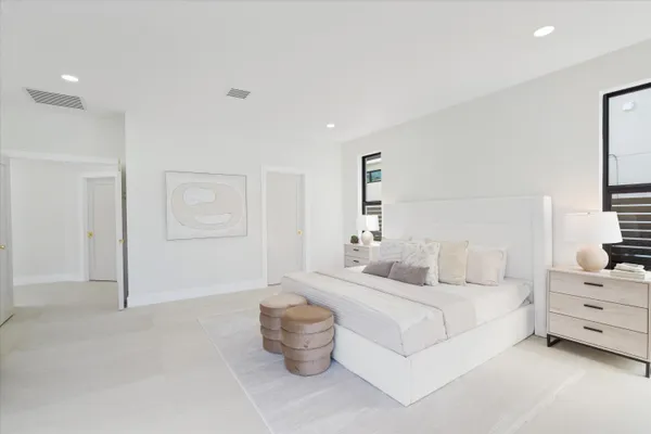 a bathroom with a tub a toilet and a shower