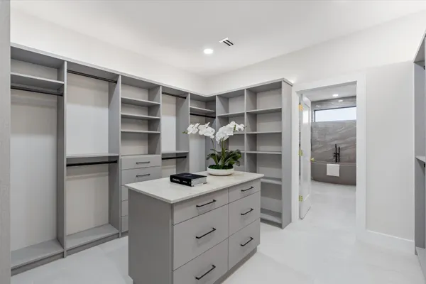 a bathroom with a white a white bath tub and a sink