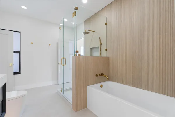 a bathroom with a shower and a sink