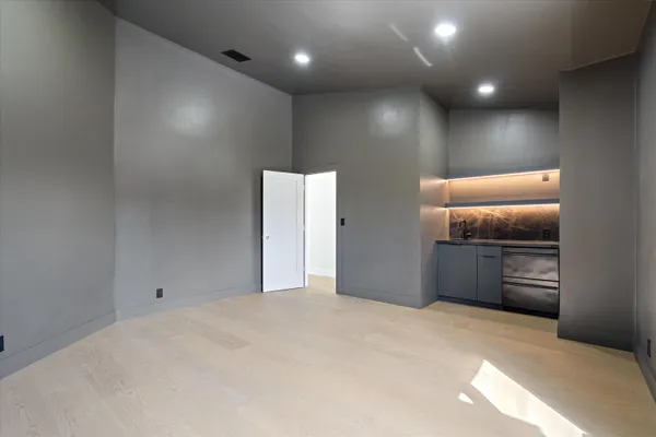 a bathroom with a sink mirror and shower