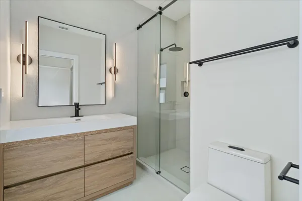 an aerial view of houses with outdoor space