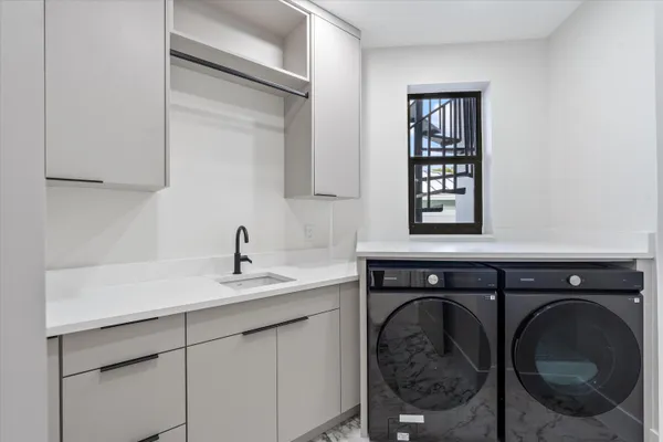 a front view of a house with yard and garage