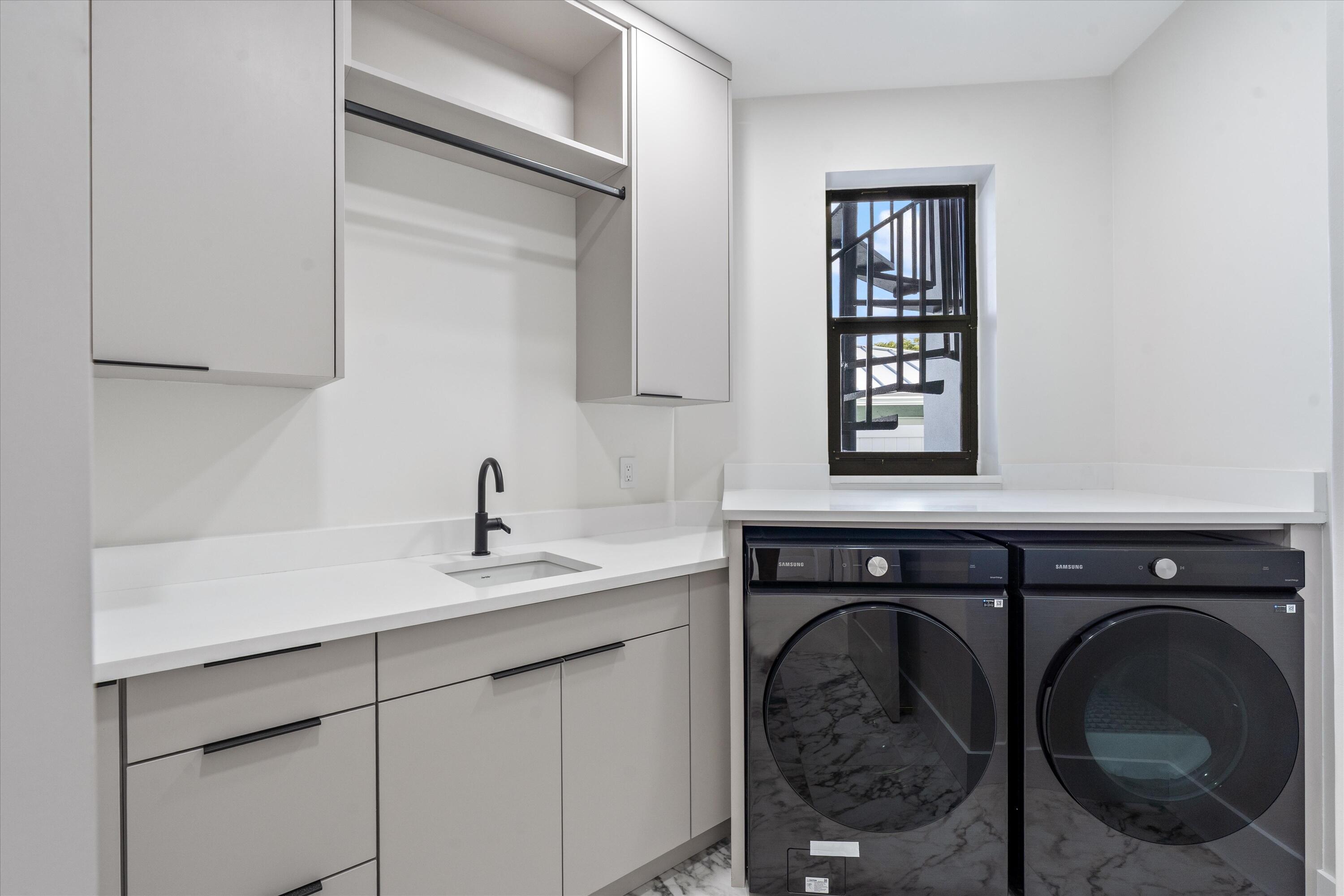 3721 Northeast 30th Avenue Lighthouse Point, FL 33064 - Photo 45 of 70 a utility room with a sink and a mirror