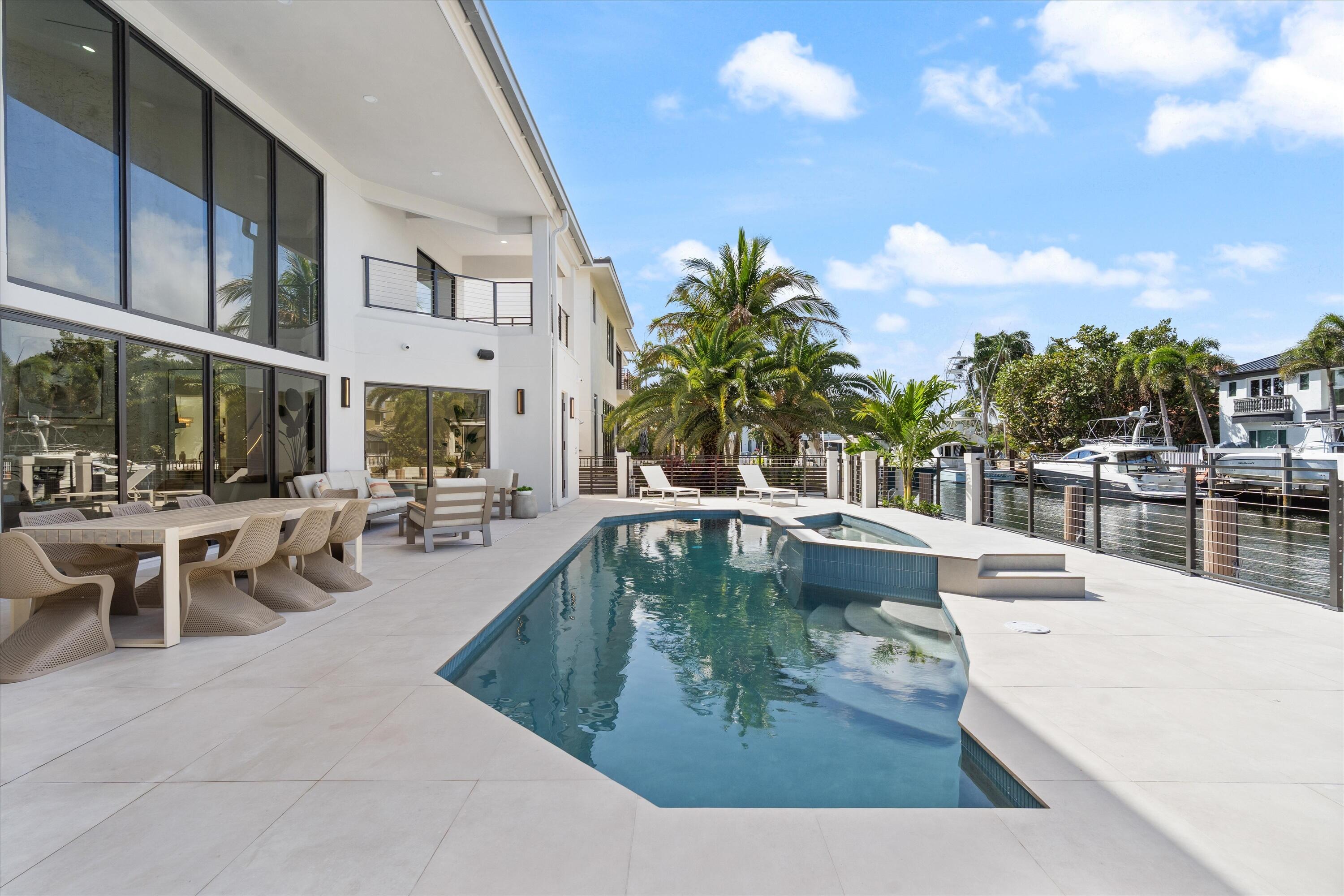 3721 Northeast 30th Avenue Lighthouse Point, FL 33064 - Photo 50 of 70 a view of a swimming pool with outdoor seating