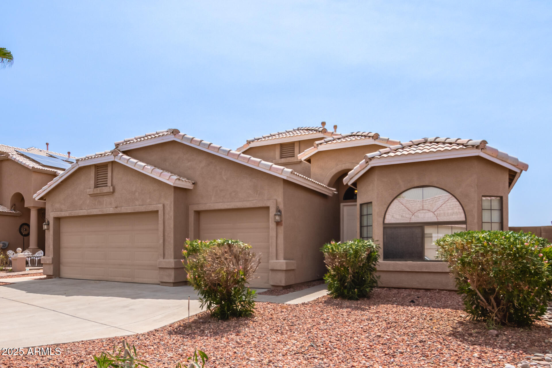 8632 South 10th Lane Phoenix, AZ 85041 - Photo 1 of 31 a front view of a house with garden