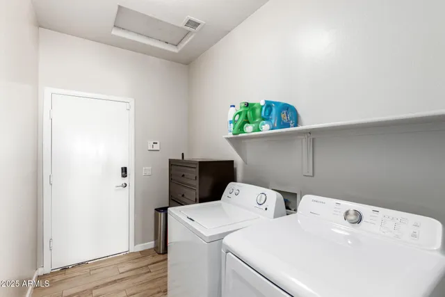 a utility room with dryer and washer
