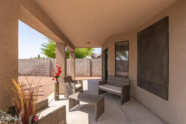 a view of a two chairs in the patio