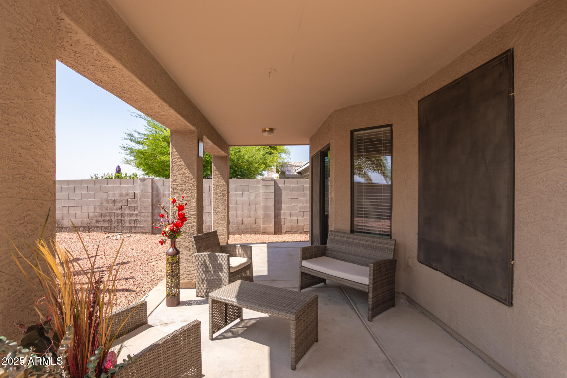 8632 South 10th Lane Phoenix, AZ 85041 - Photo 24 of 31 a view of a two chairs in the patio