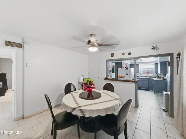 a view of a dining room with furniture and chandelier