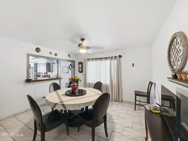 a view of a dining room with furniture and a livingroom
