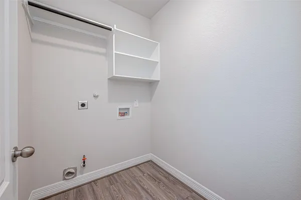 a view of a room with shelf on the wall