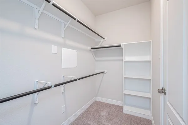 a view of an empty walk in closet