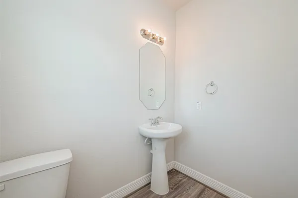 a bathroom with a sink and toilet