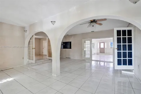 a view of empty room with windows