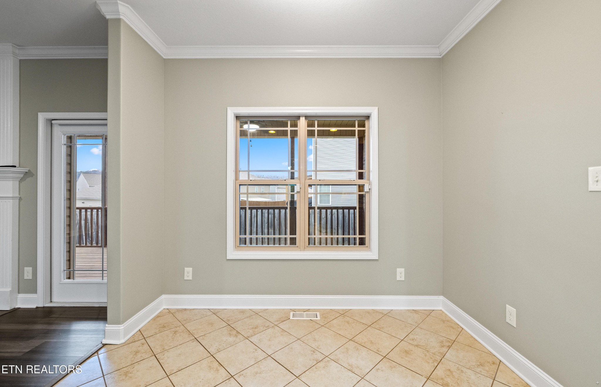 6101 Pembridge Road Knoxville, TN 37912 - Photo 11 of 29 a view of an empty room with wooden floor and a window