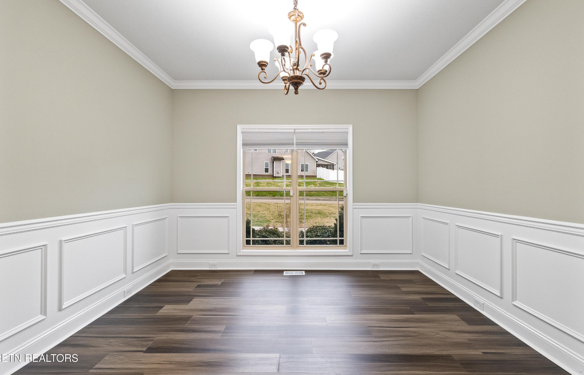 6101 Pembridge Road Knoxville, TN 37912 - Photo 12 of 29 a view of an empty room with wooden floor and a window