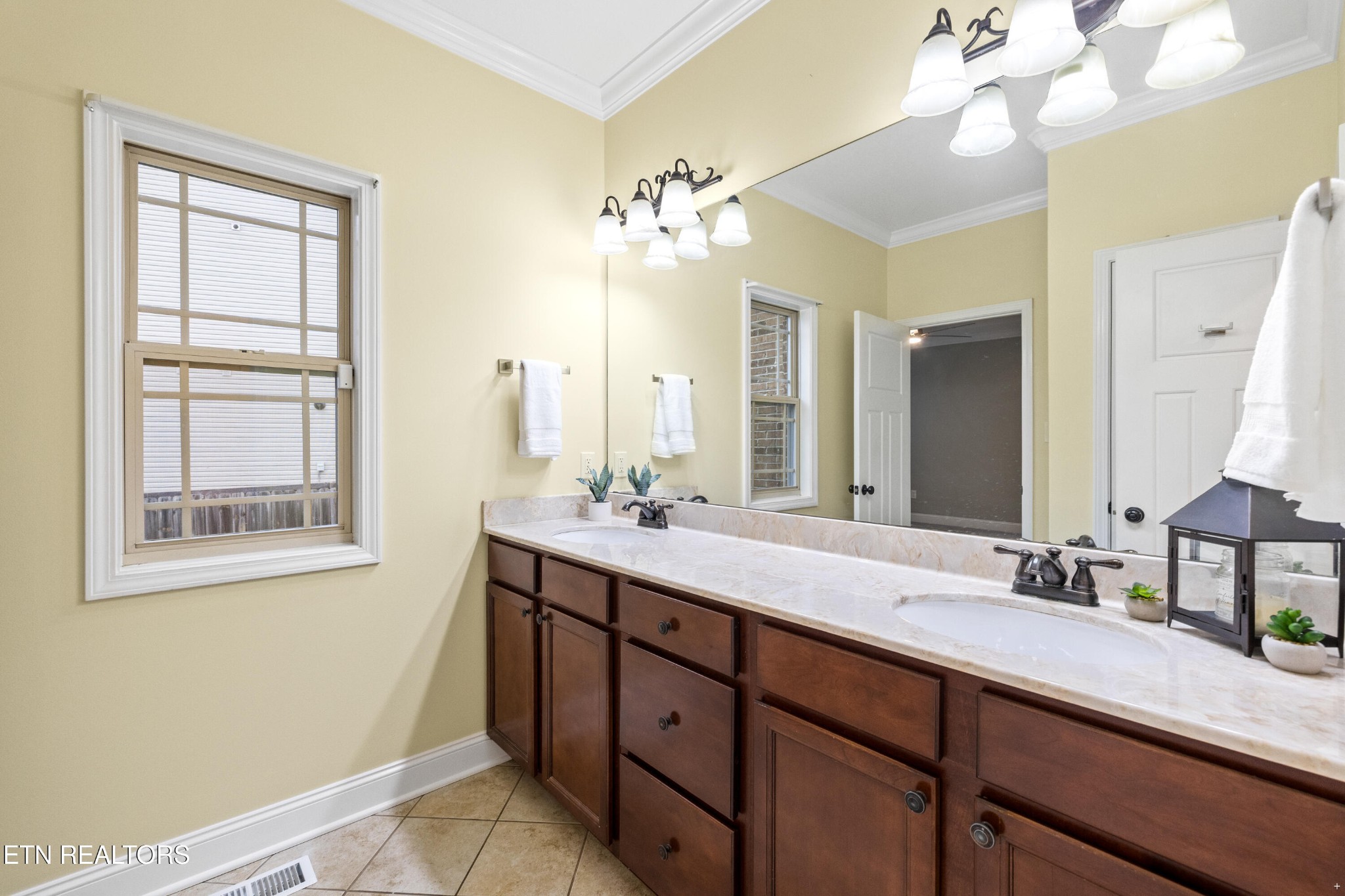 6101 Pembridge Road Knoxville, TN 37912 - Photo 15 of 29 a bathroom with a double vanity sink and a mirror