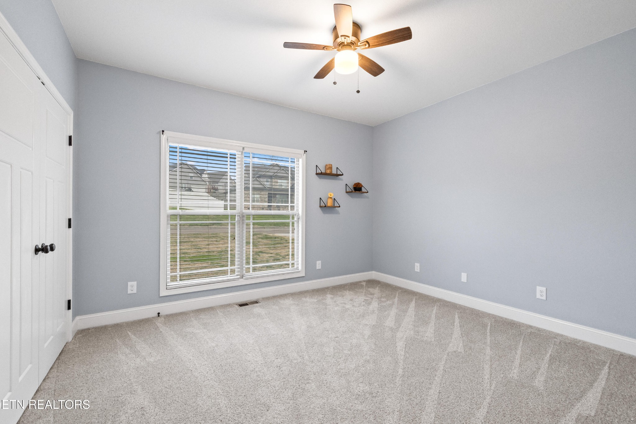 6101 Pembridge Road Knoxville, TN 37912 - Photo 18 of 29 an empty room with a empty space and a ceiling fan