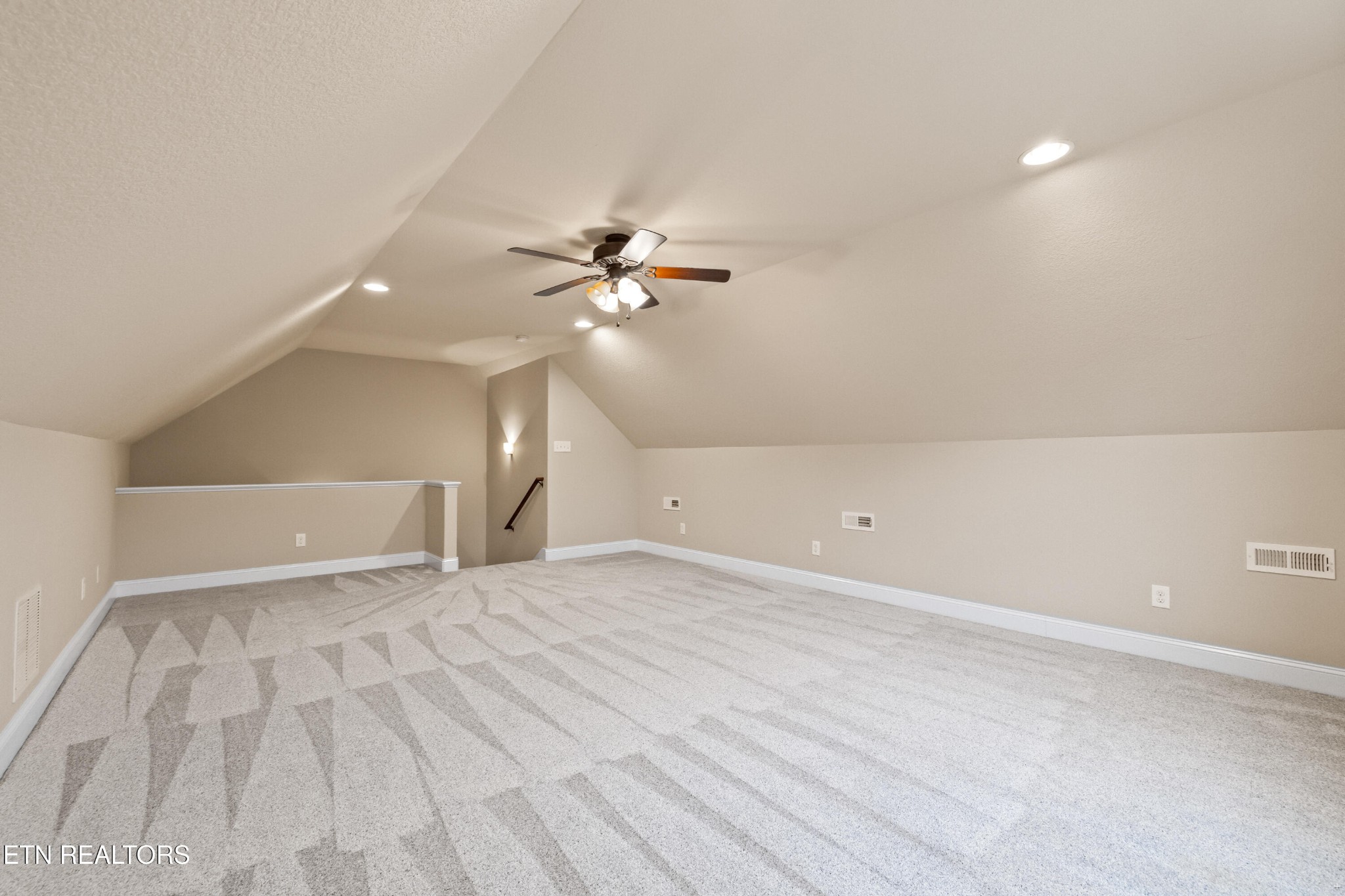 6101 Pembridge Road Knoxville, TN 37912 - Photo 22 of 29 a view of an empty room with a chandelier fan