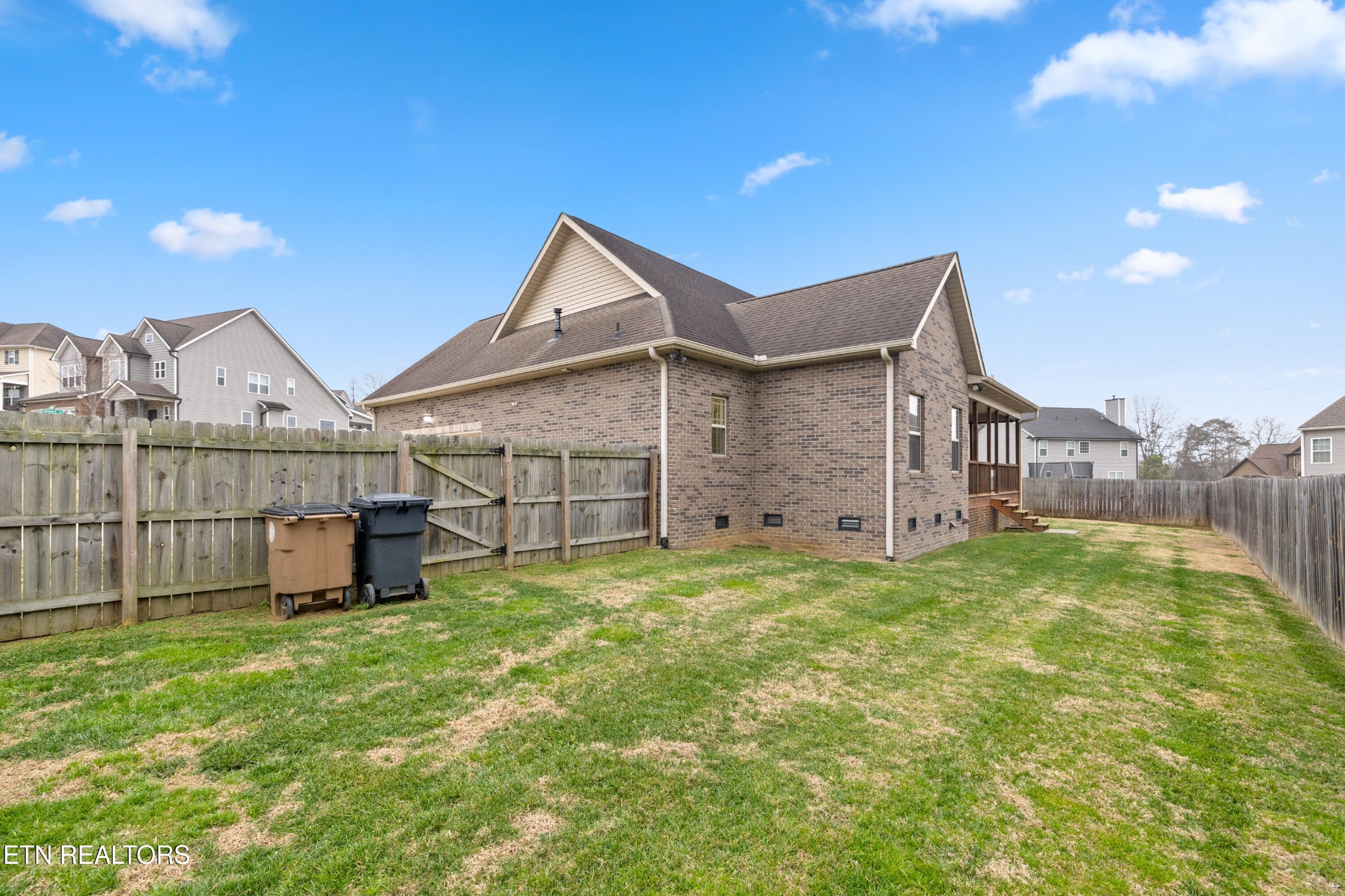 6101 Pembridge Road Knoxville, TN 37912 - Photo 24 of 29 a view of a front of a house with a yard and garage