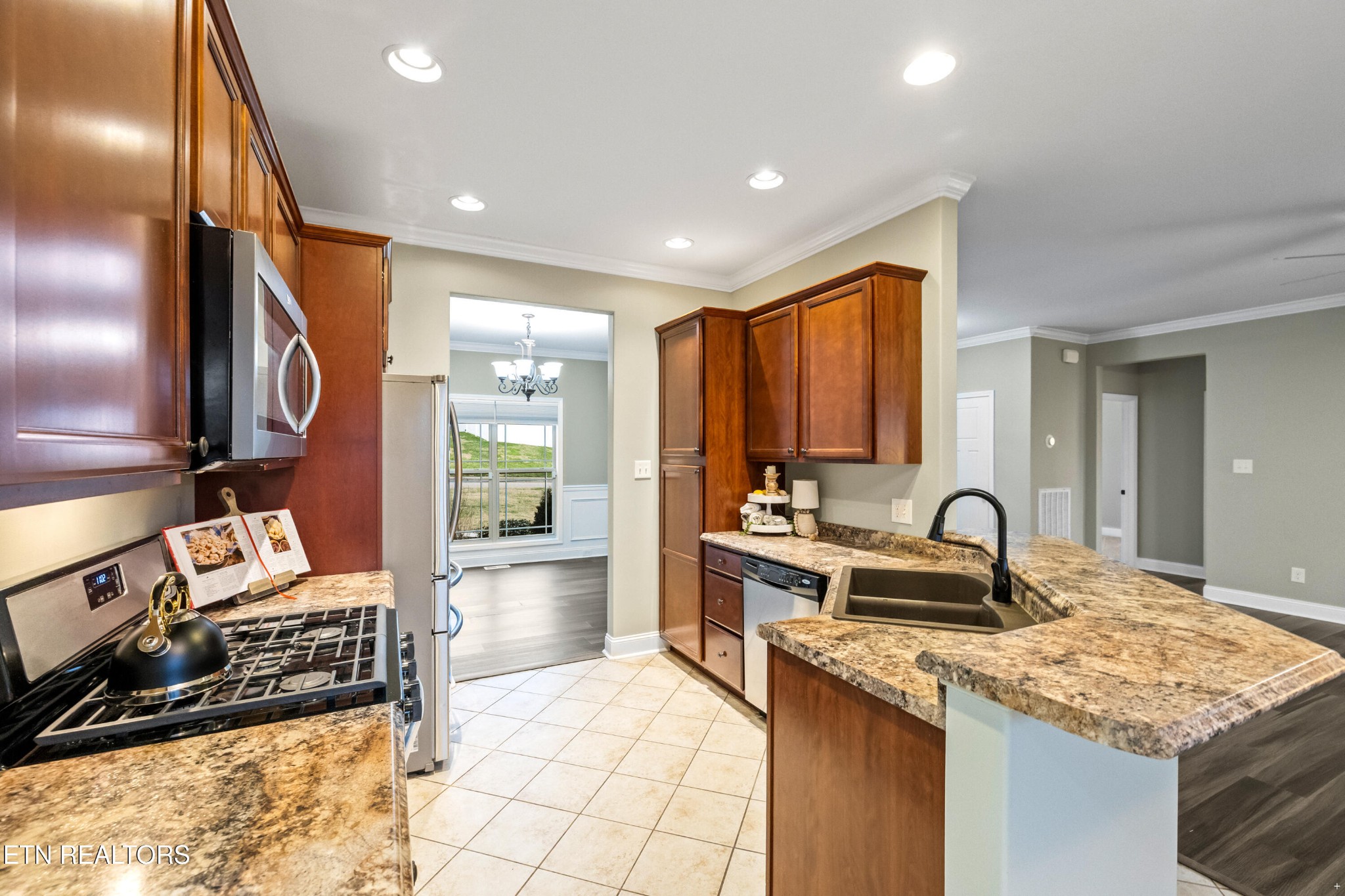 6101 Pembridge Road Knoxville, TN 37912 - Photo 7 of 29 a kitchen with a sink and a stove top oven