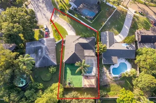 an aerial view of houses with yard