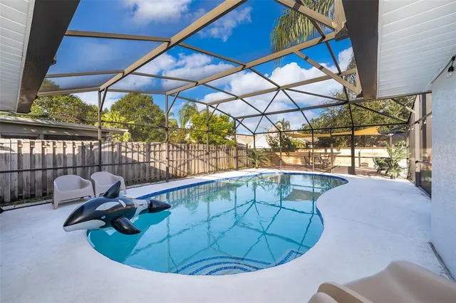 a view of a swimming pool with a patio