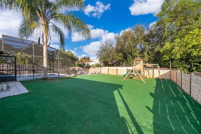 a view of a park with swings and slides