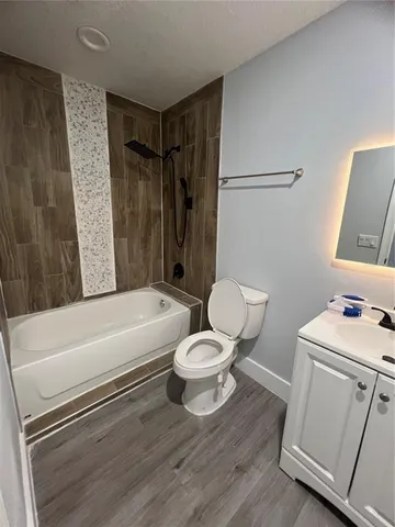 an empty room with wooden floor