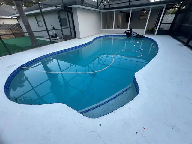 a kitchen with stainless steel appliances a refrigerator and a stove top oven