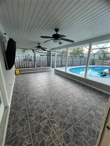a kitchen with a stove sink and cabinets