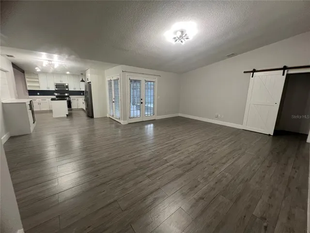 a kitchen with a sink and a refrigerator