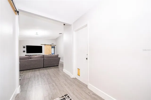 a living room with a couch and a flat screen tv