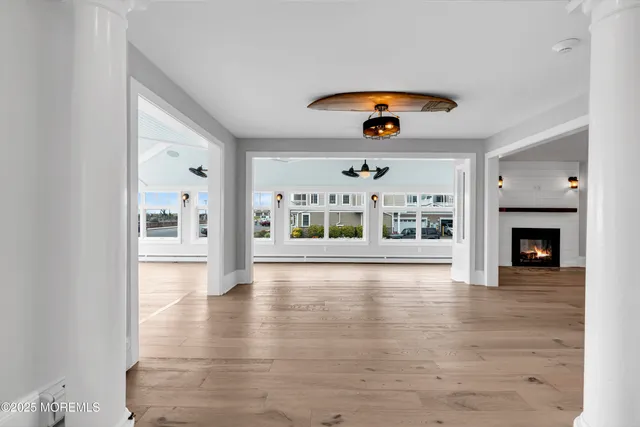 a view of a dining room with furniture wooden floor and a chandelier