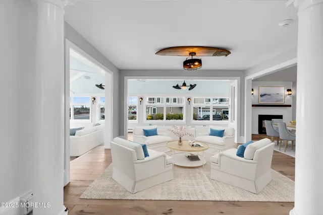 a kitchen with granite countertop white cabinets and stainless steel appliances