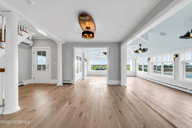 a kitchen with a stove a sink and a window