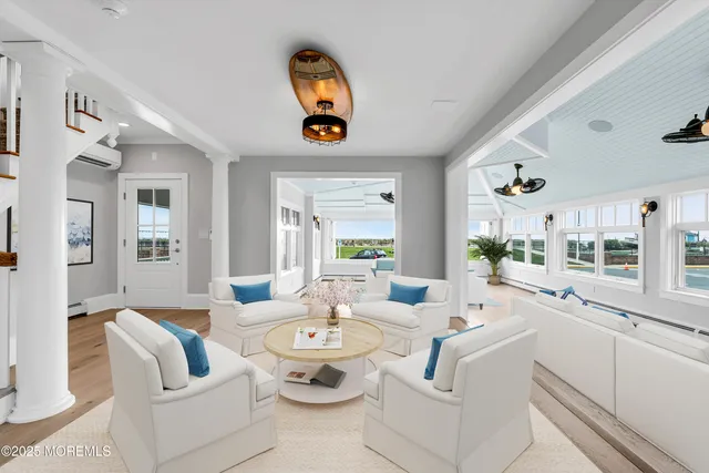 a large kitchen with stainless steel appliances granite countertop a stove and a wooden floors