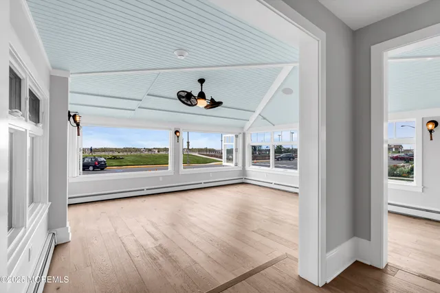 a bathroom with a shower sink and mirror