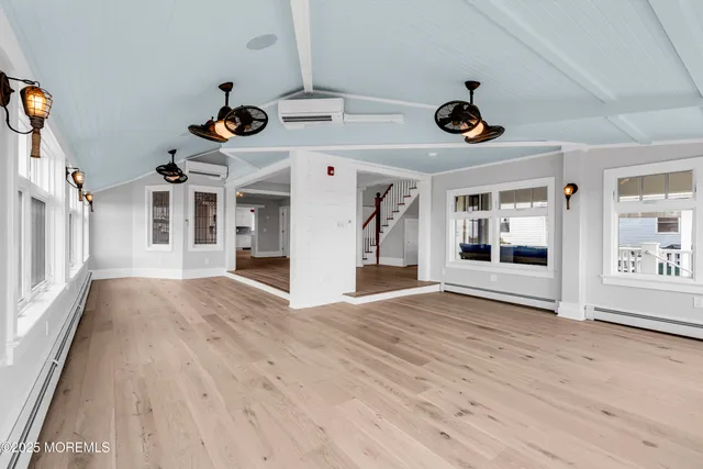 a view of a room with wooden floor and closet
