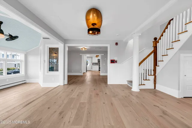 a bathroom with a granite countertop sink a toilet and shower