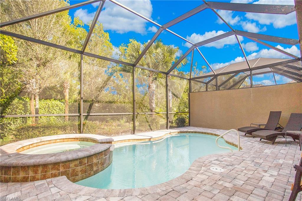 7674 Jacaranda Lane Naples, FL 34114 - Photo 22 of 45 a view of a swimming pool