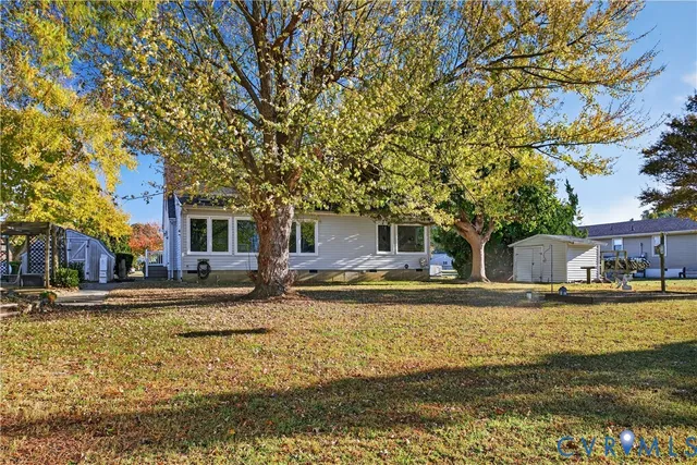 a house view with swimming pool in front of it