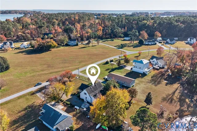 a view of swimming pool with outdoor seating and plants