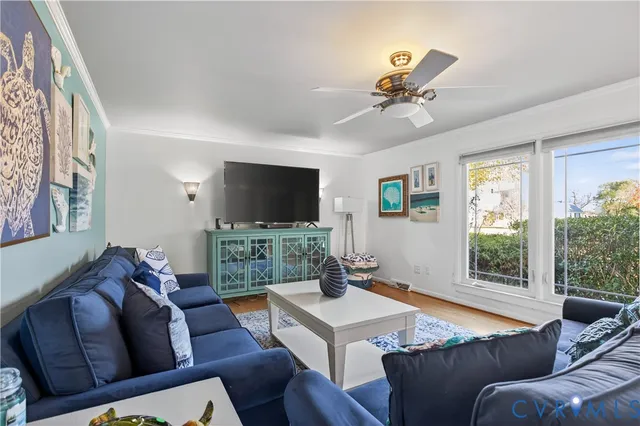 a living room with furniture and a flat screen tv