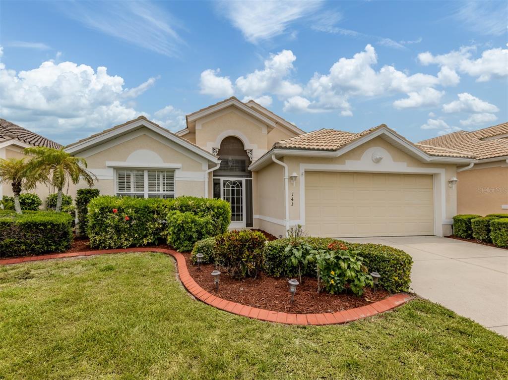143 Braemar Avenue Venice, FL 34293 - Photo 1 of 1 a front view of a house with a yard