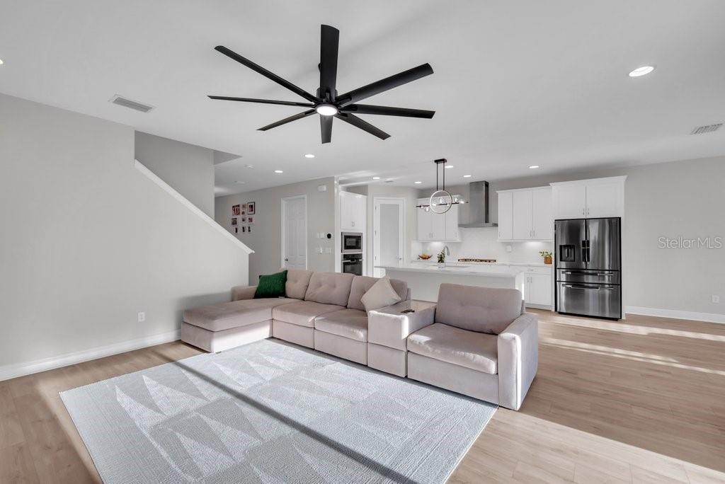 14604 Horse Trot Road Lithia, FL 33547 - Photo 11 of 62 a living room with furniture and a view of kitchen