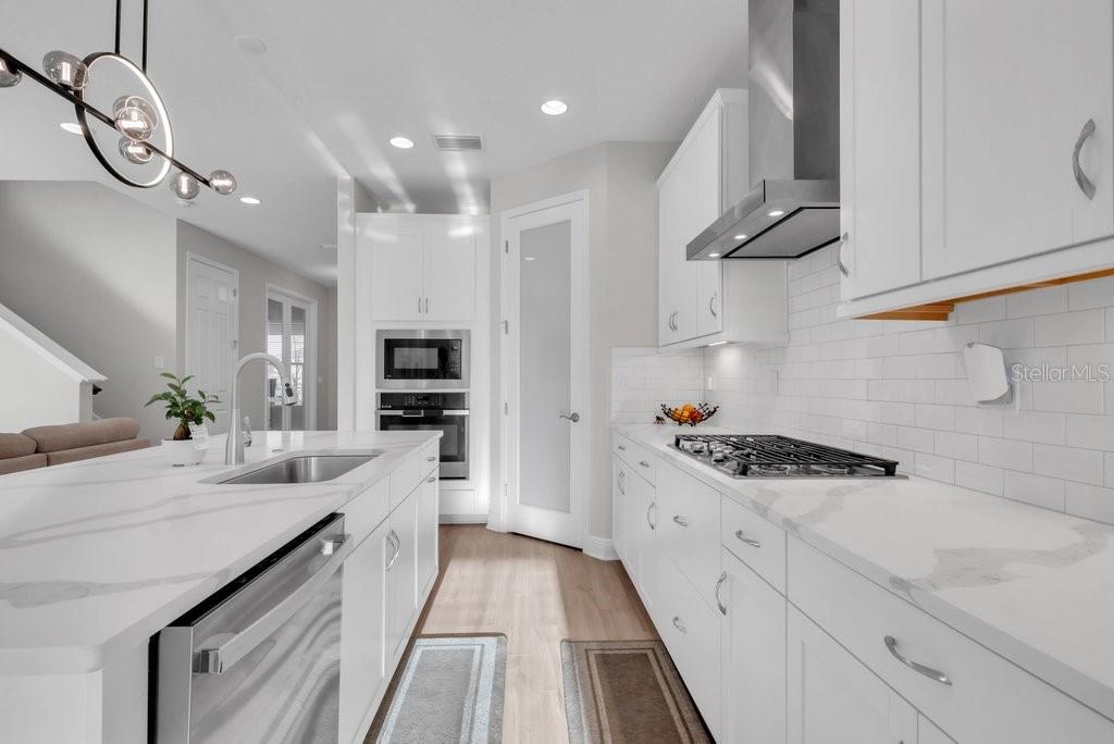 14604 Horse Trot Road Lithia, FL 33547 - Photo 16 of 62 a kitchen with kitchen island granite countertop a sink and stainless steel appliances