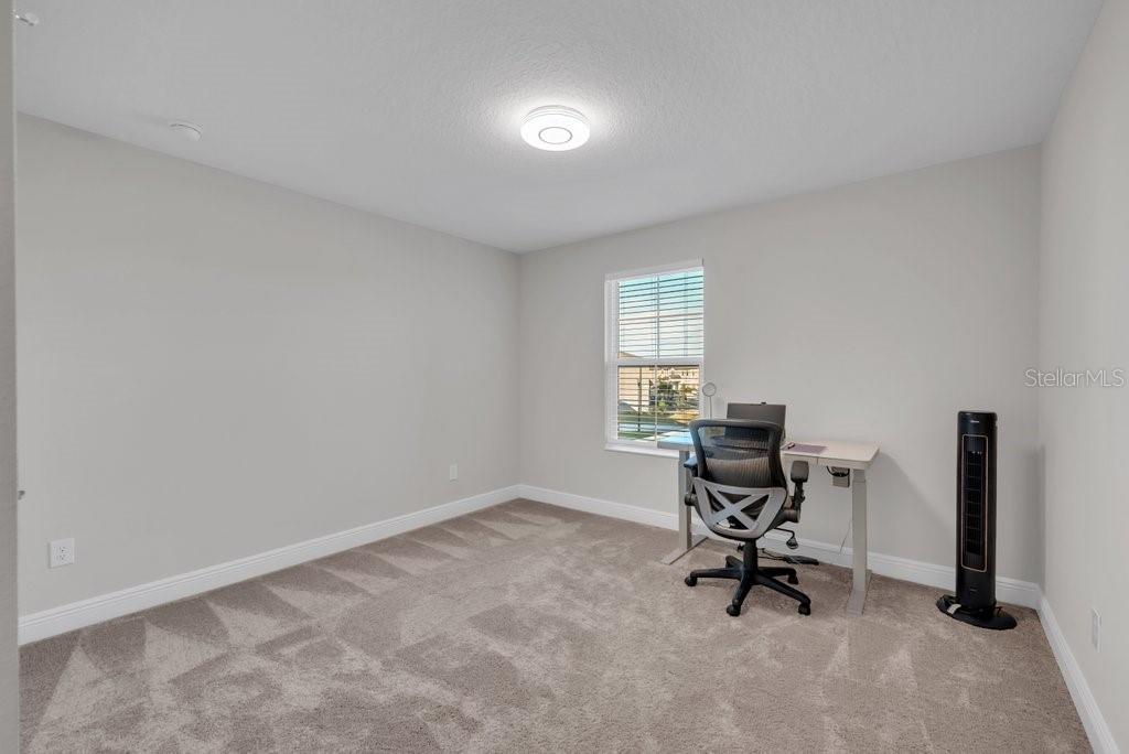 14604 Horse Trot Road Lithia, FL 33547 - Photo 24 of 62 a view of a workspace with furniture and a window